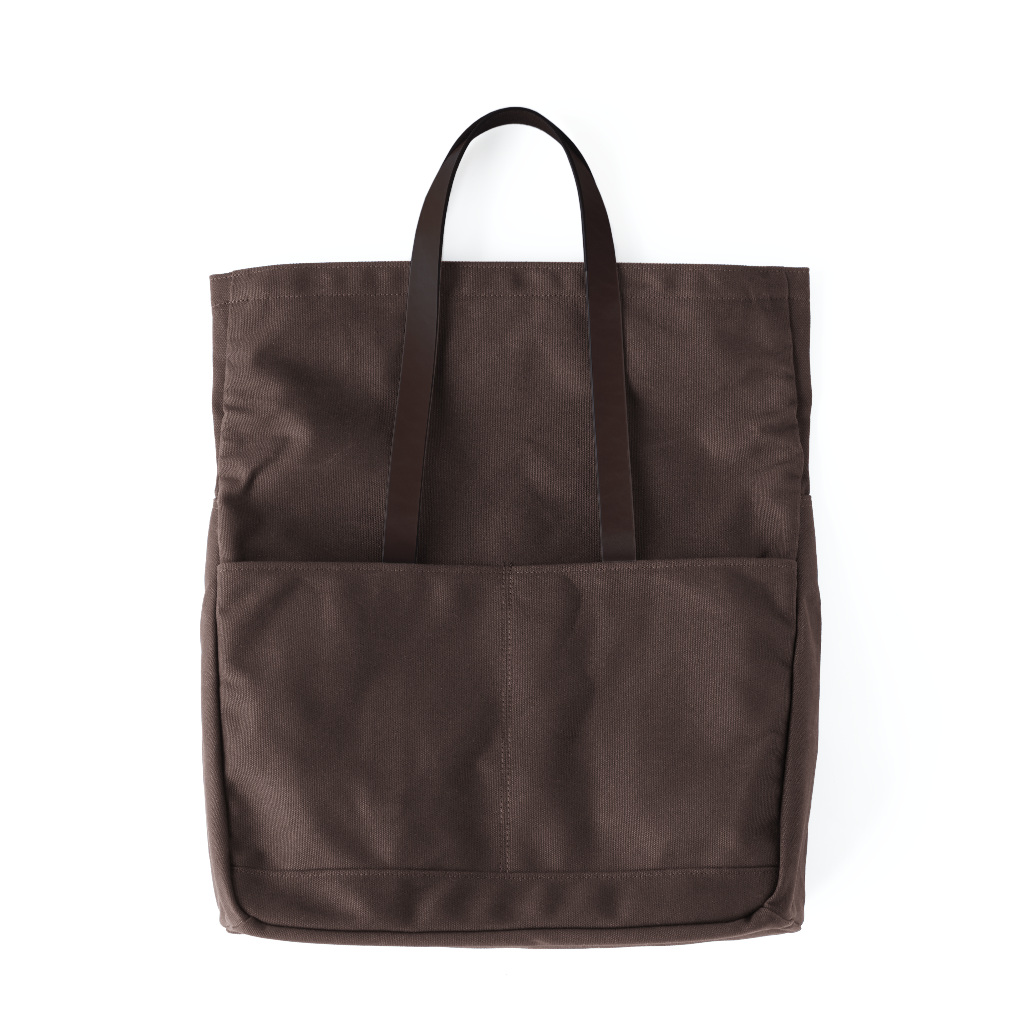 The MAKR Canvas and Leather Fold Weekender in Brown canvas and English Bridle leather with the top unfolded.