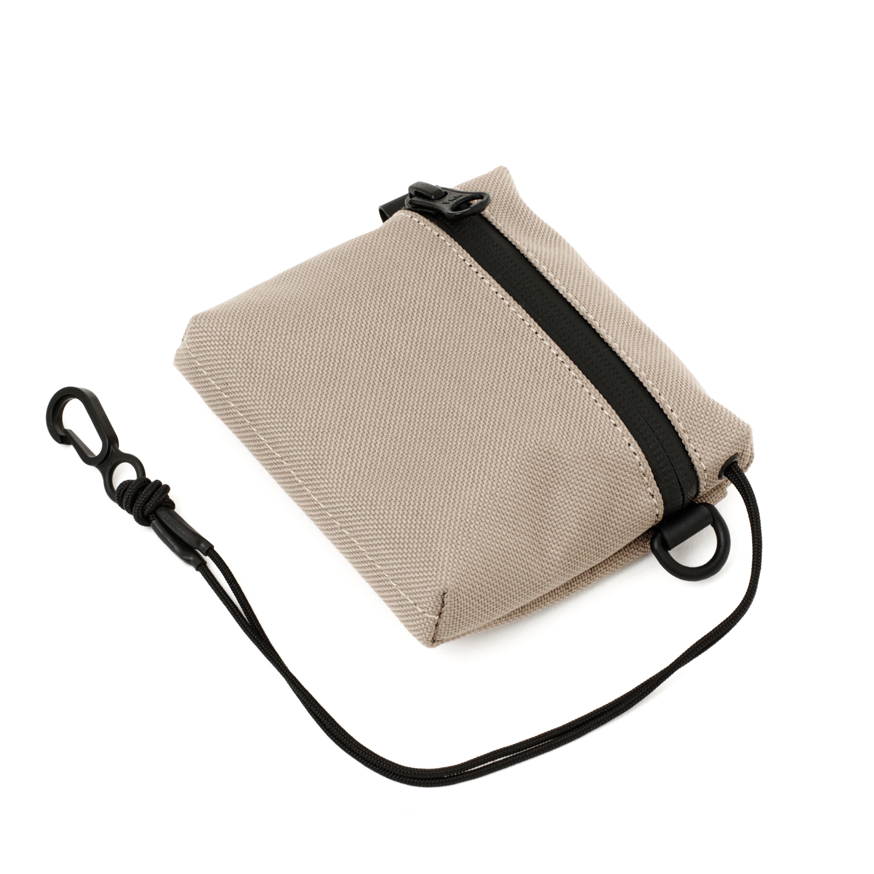 The MAKR Bracket Pouch/Wallet in Sand bonded poly duck, shown at an angle.
