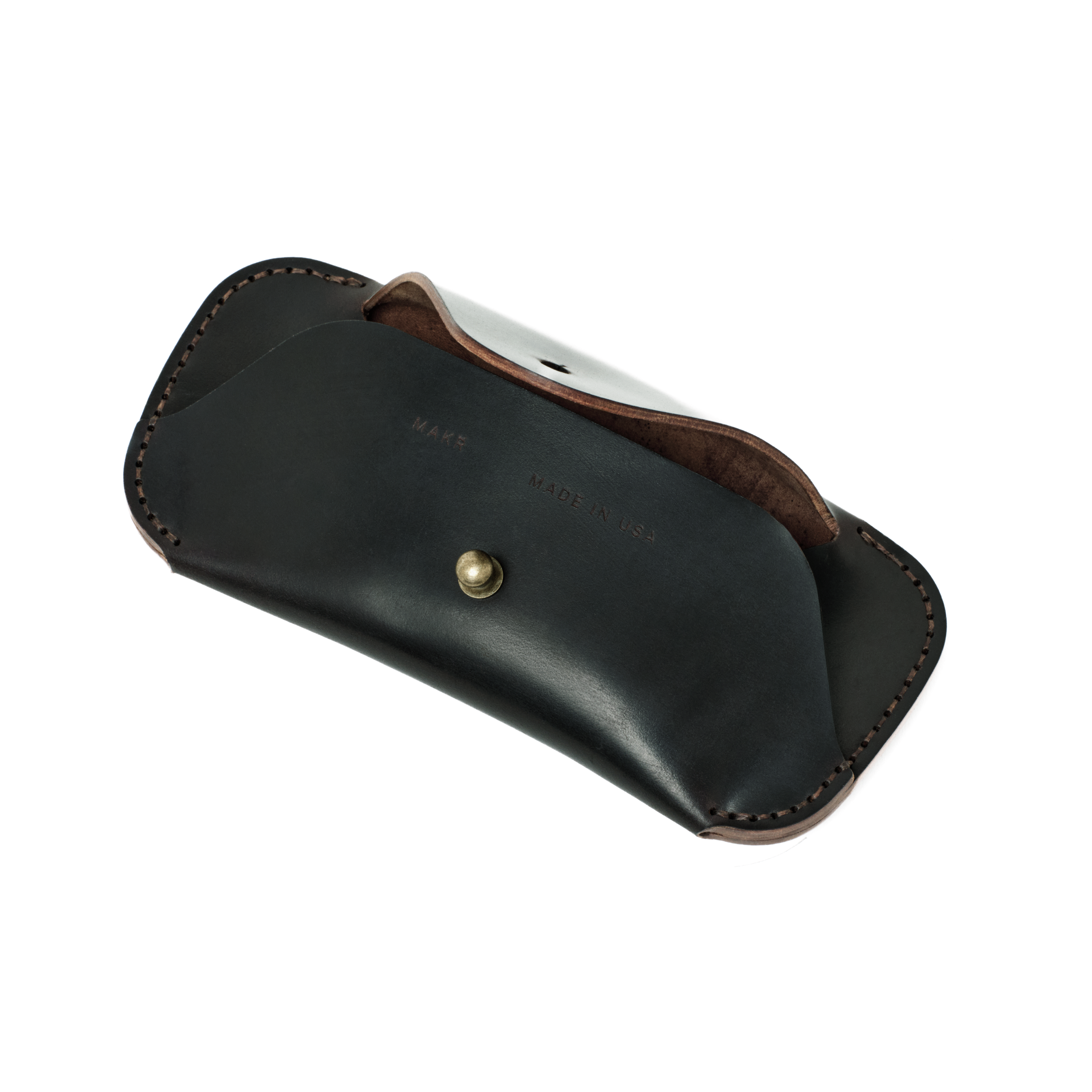 Angled view of the MAKR Cordovan Eyewear Sleeve V3 HS in Black Horween Shell Cordovan, open.