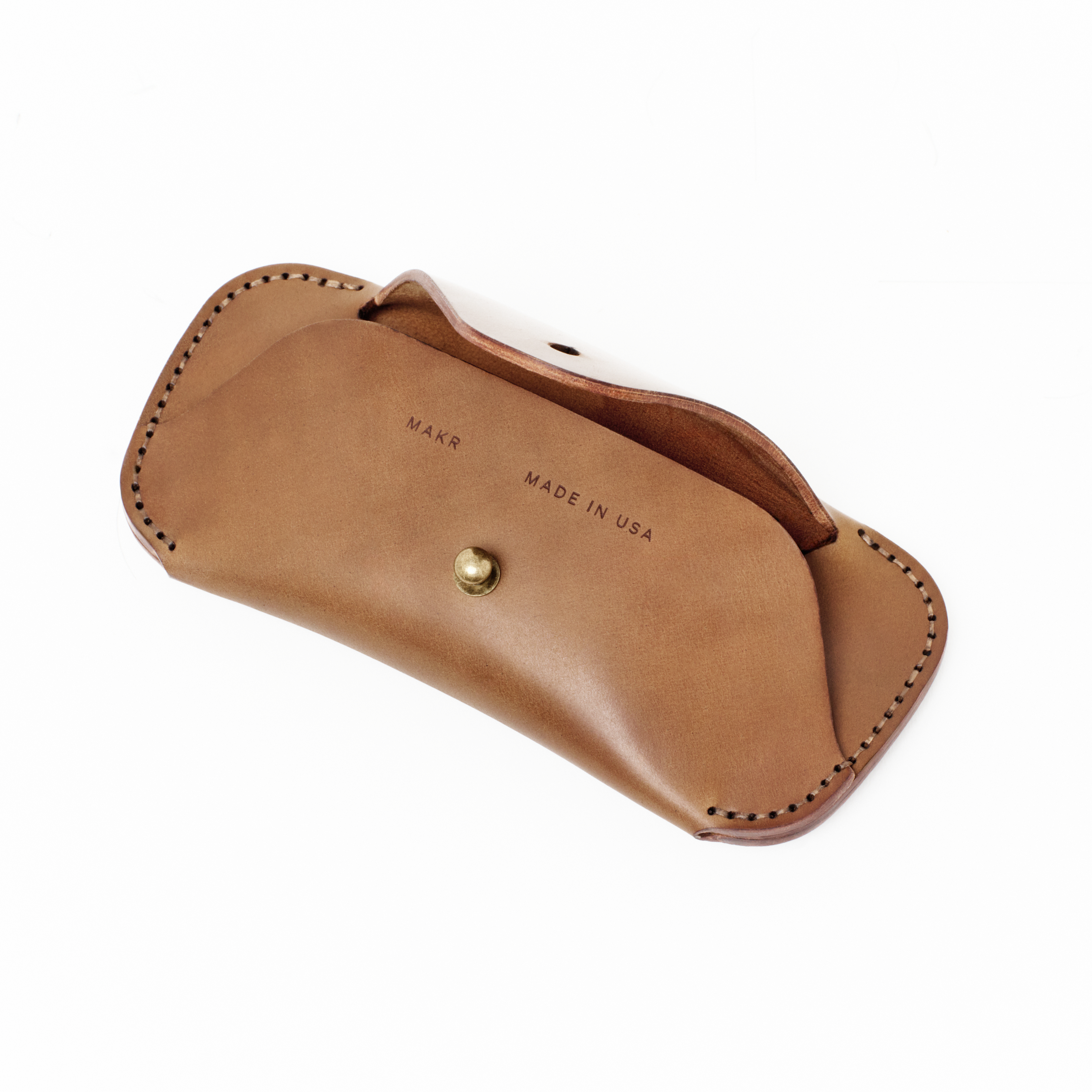 Angled view of the MAKR Cordovan Eyewear Sleeve V3 HS in Natural Horween Shell Cordovan, open.