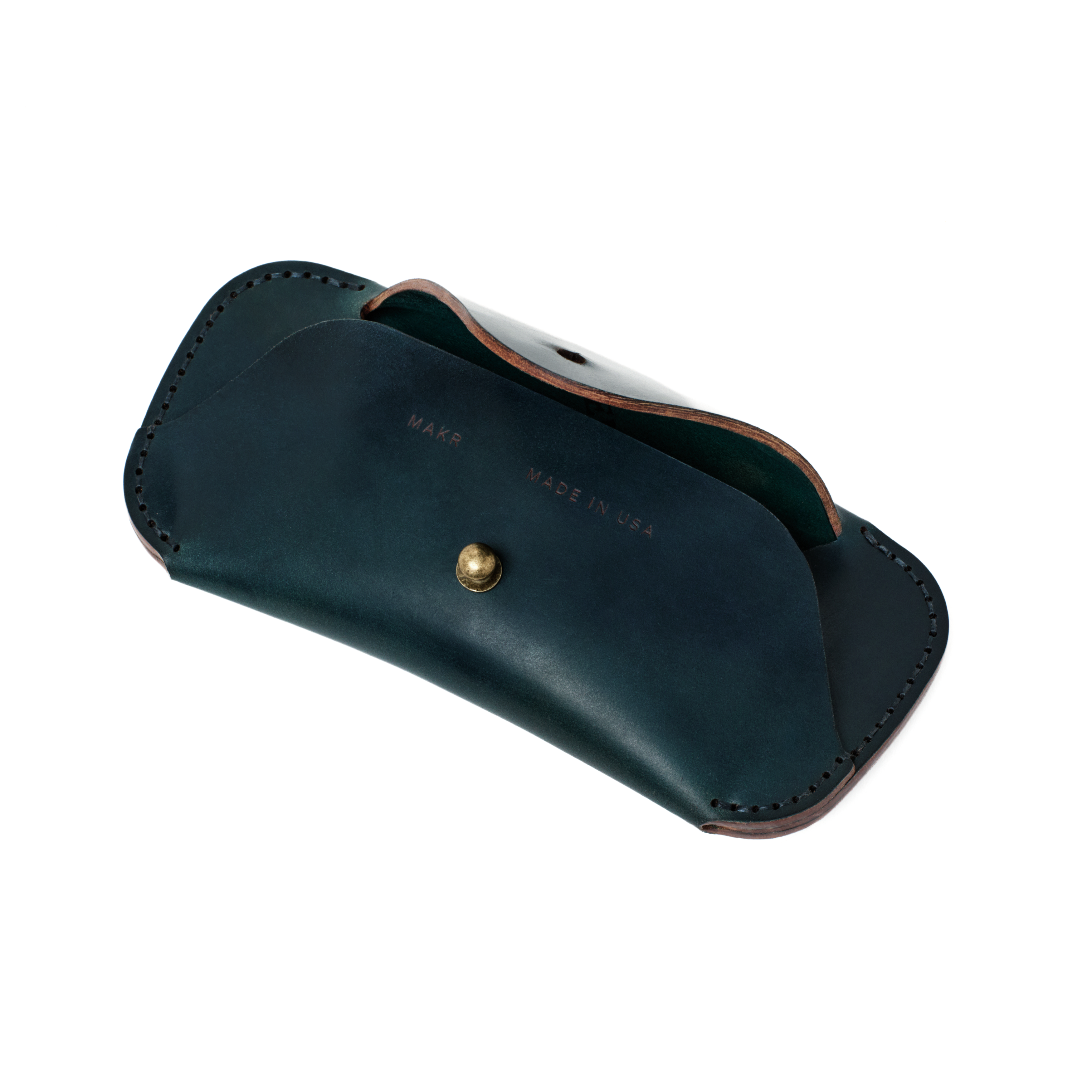 Angled view of the MAKR Cordovan Eyewear Sleeve V3 HS in Navy Horween Shell Cordovan, open.