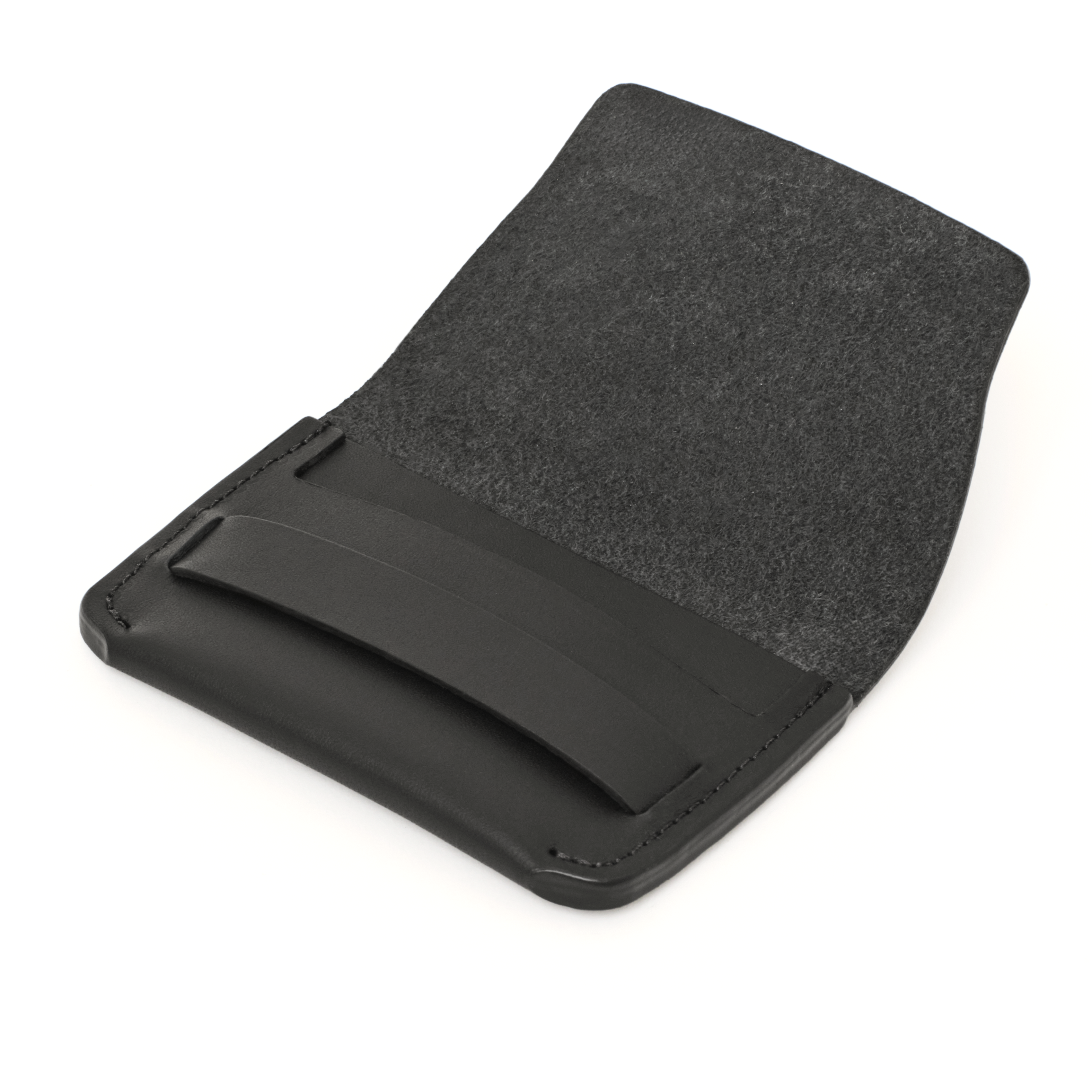 Angled view of the MAKR Flap Wallet PLUS V2 in Black Horween Latigo leather, open.