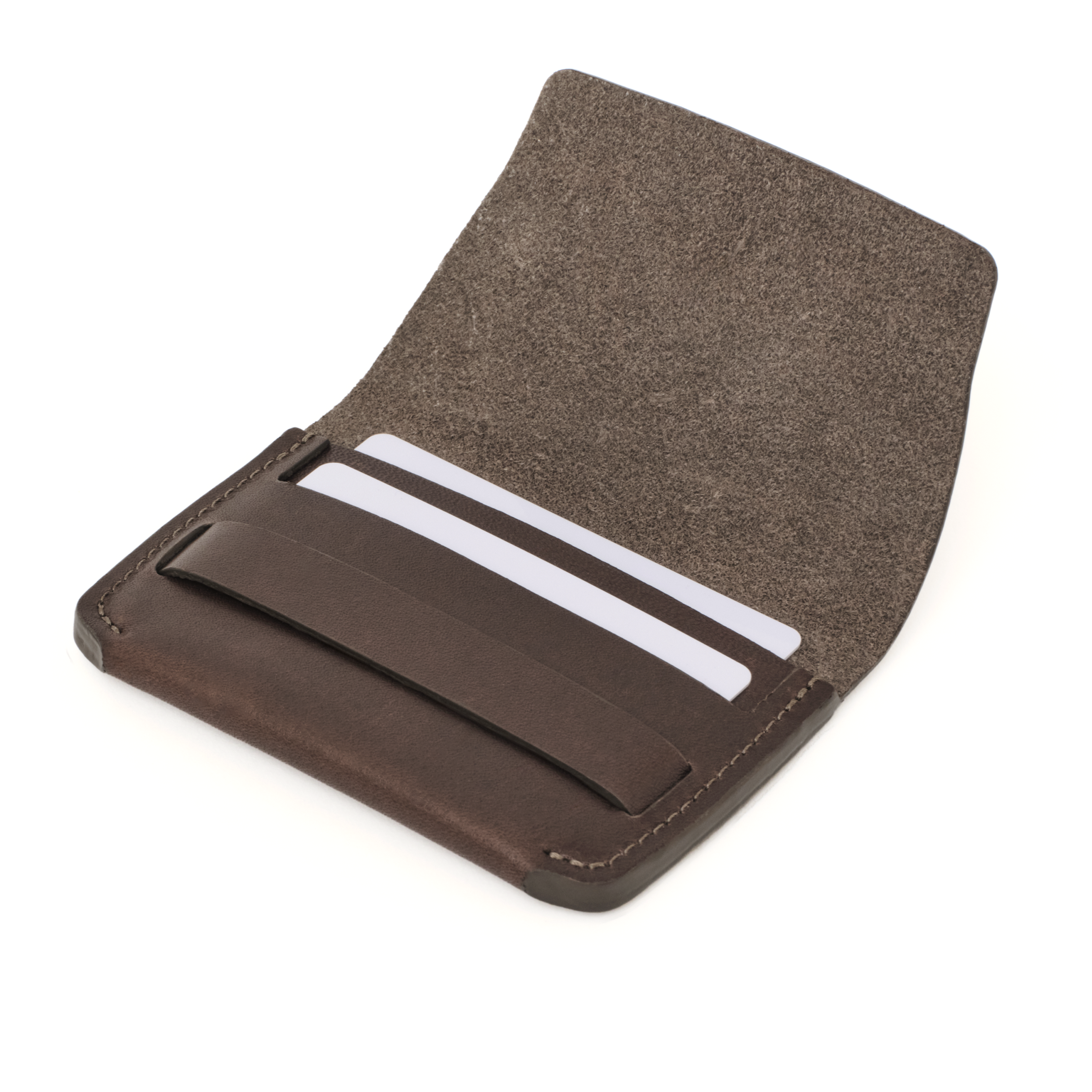 Angled view of the MAKR Flap Wallet PLUS V2 in Brown Horween Latigo leather holding cards.