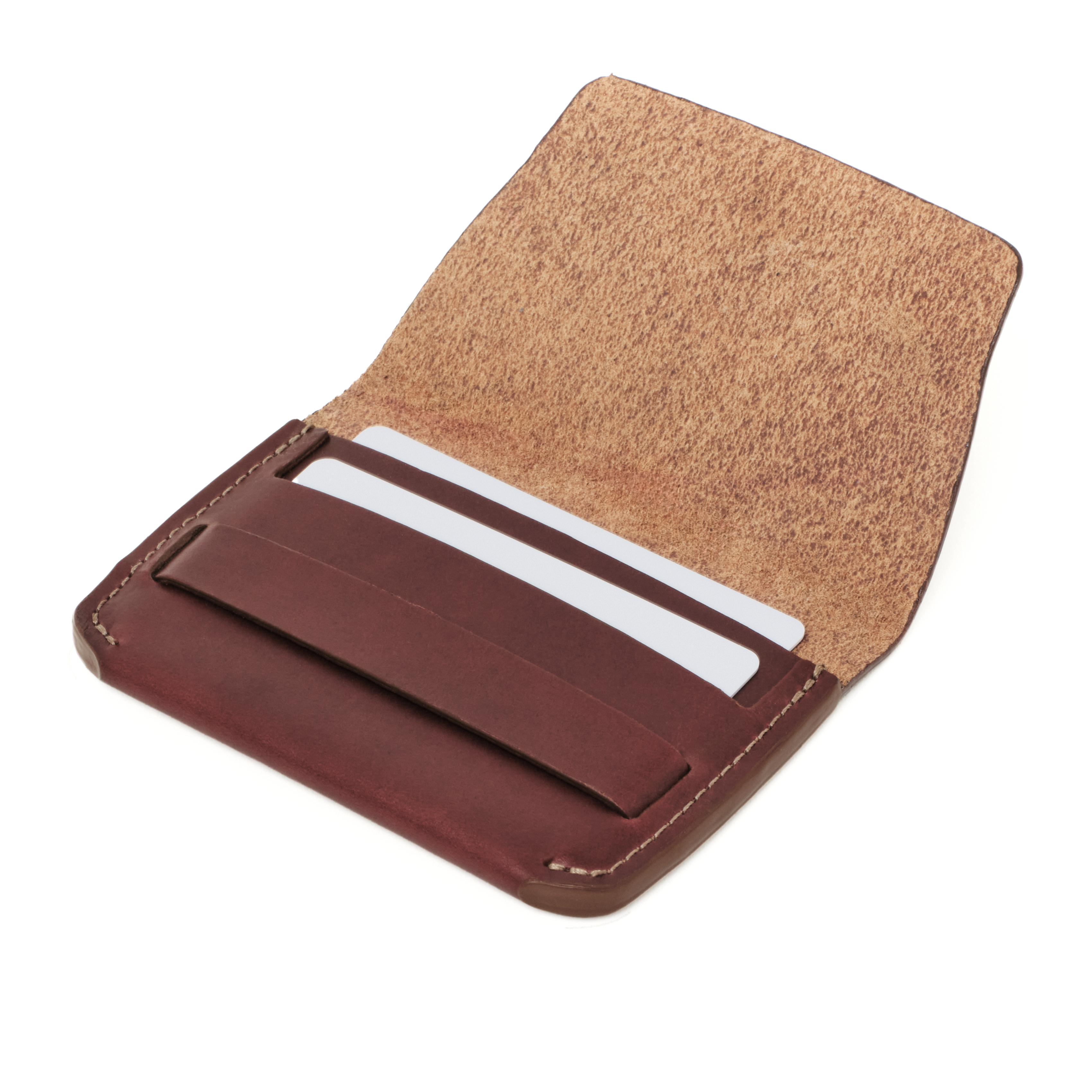 Angled view of the MAKR Flap Wallet PLUS V2 in Ox Blood Horween Chromexcel leather holding cards.