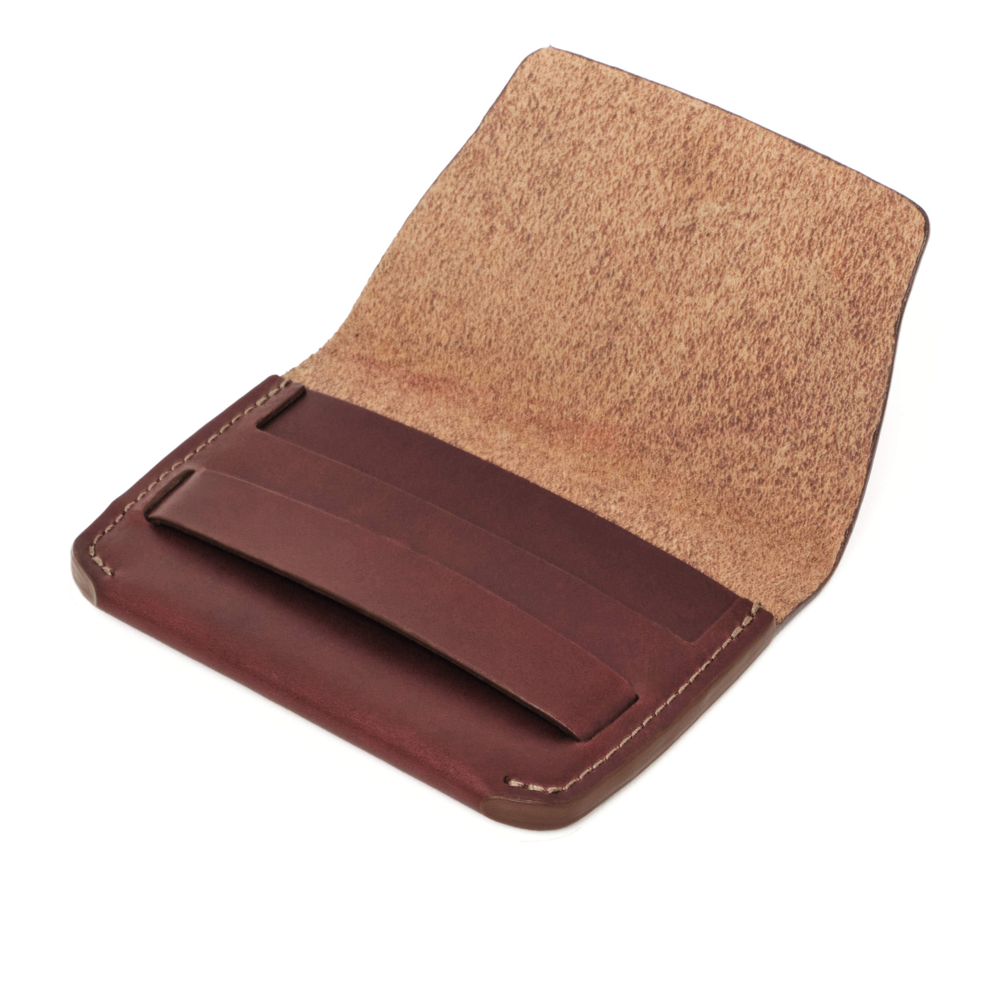 Angled view of the MAKR Flap Wallet PLUS V2 in Ox Blood Horween Chromexcel leather, open.