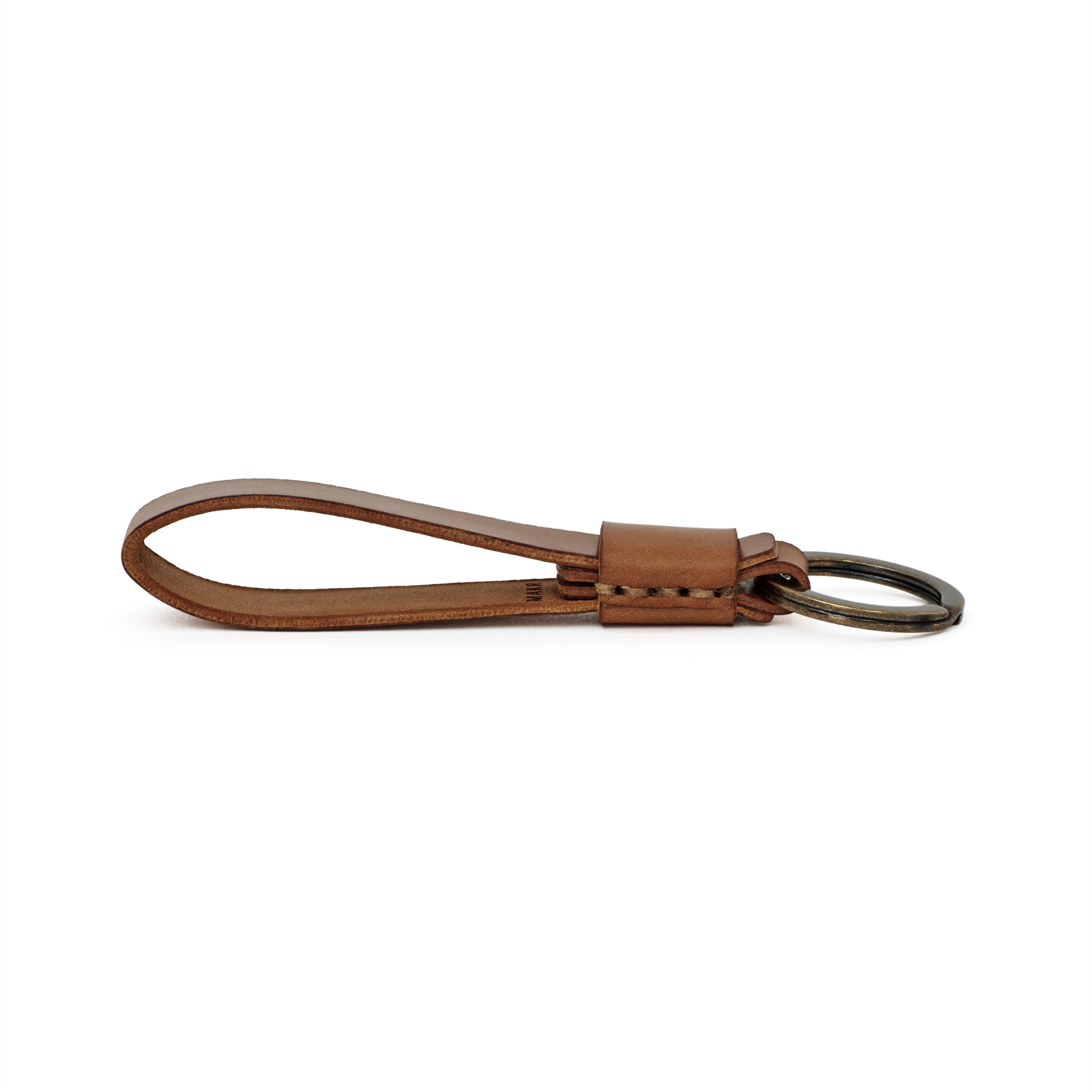 Side profile of the natural cordovan Overlap Keychain showing handsewn stitching and burnished edges.