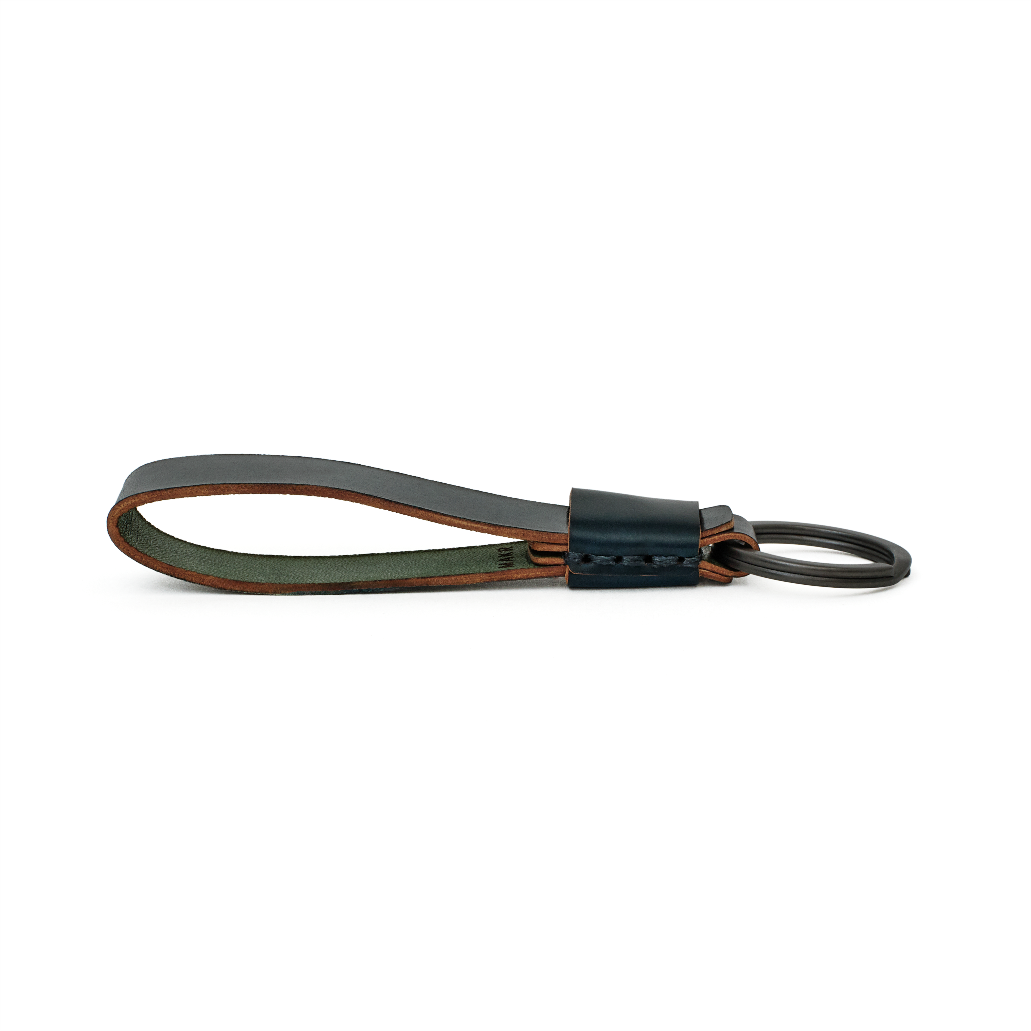 Side profile of the navy cordovan Overlap Keychain showing handsewn stitching and burnished edges.