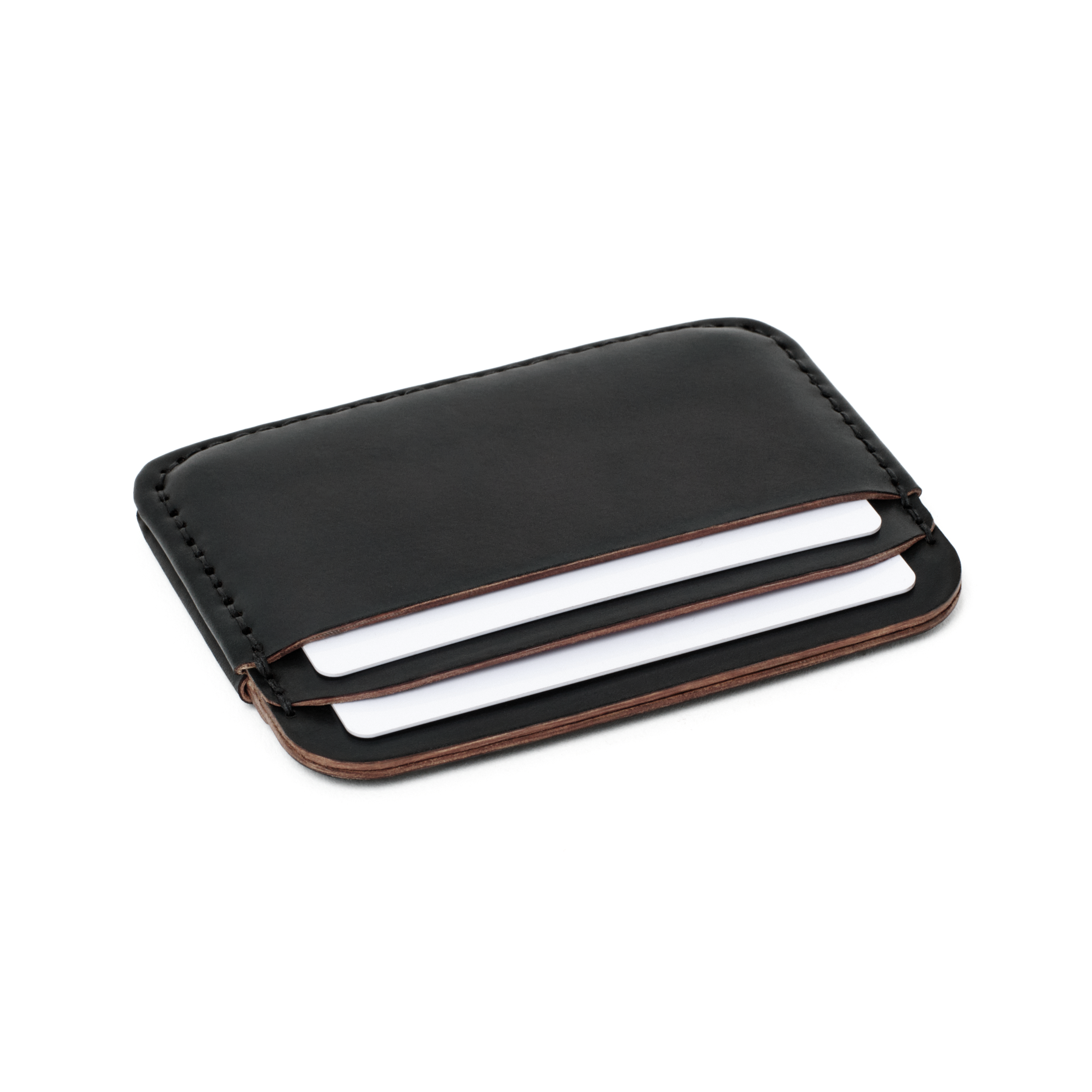 Angled view of the MAKR Round Luxe PLUS Wallet in Black Horween Shell Cordovan holding cards.