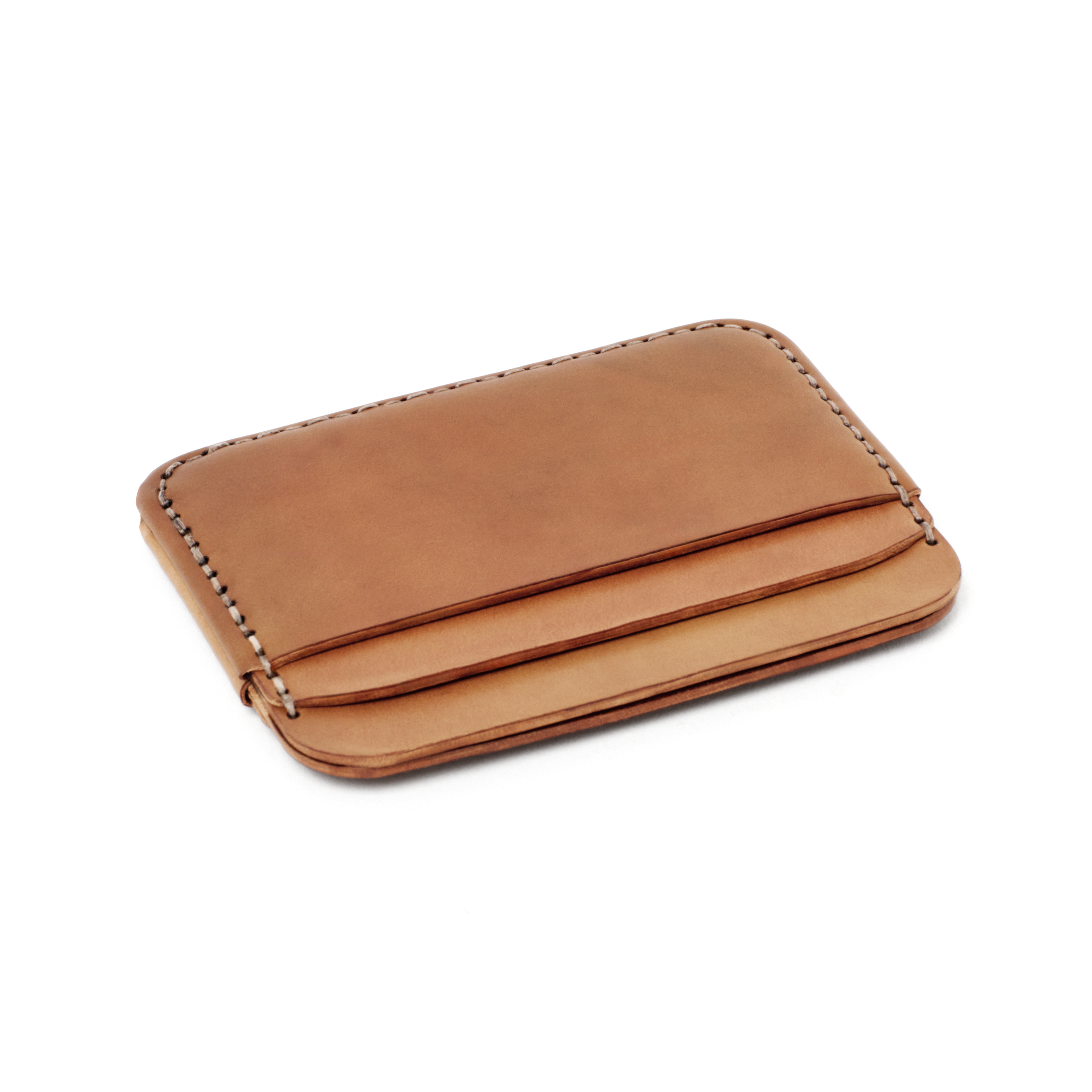The MAKR Round Luxe PLUS Wallet in Natural Horween Shell Cordovan, shown at an angle.