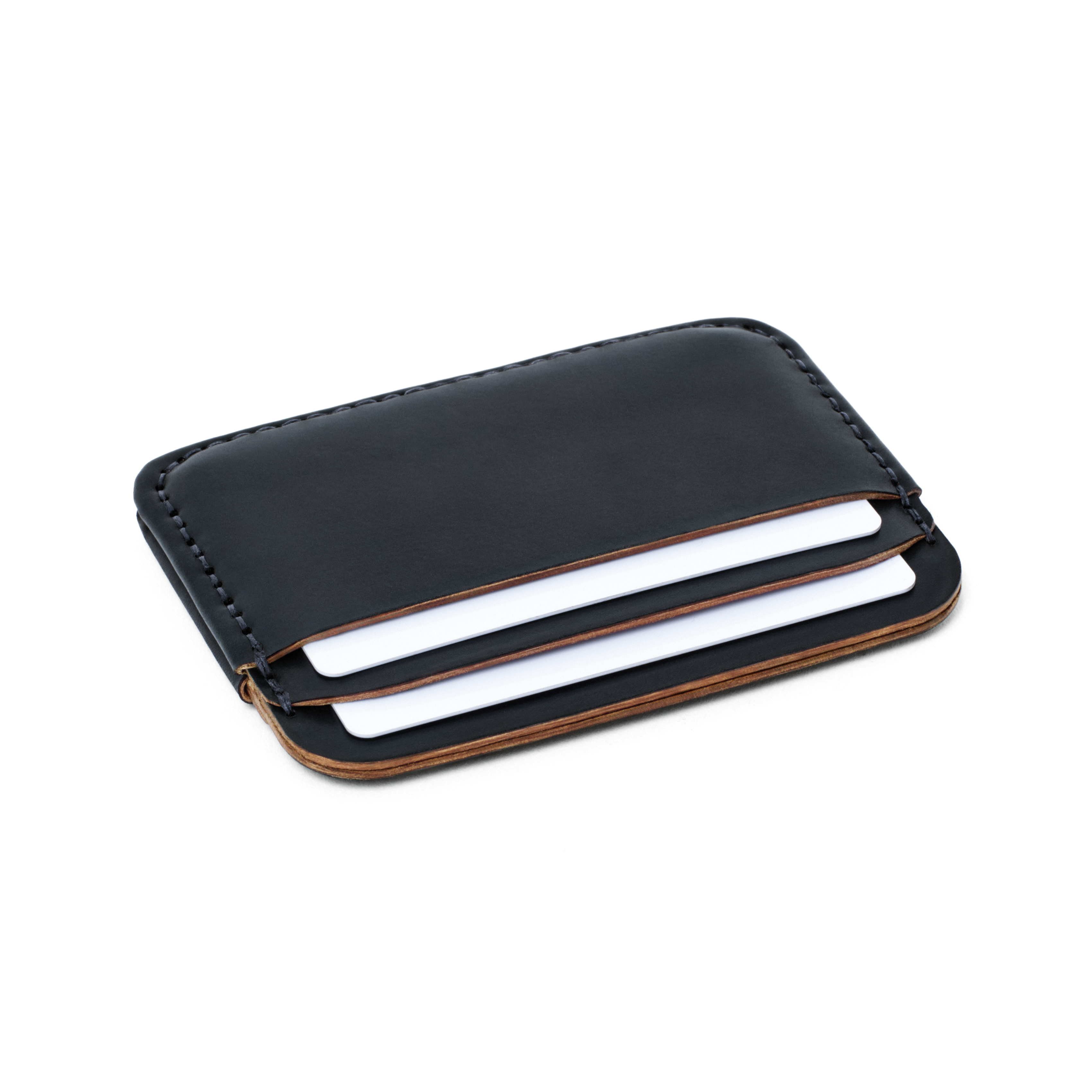 Angled view of the MAKR Round Luxe PLUS Wallet in Navy Horween Shell Cordovan holding cards.