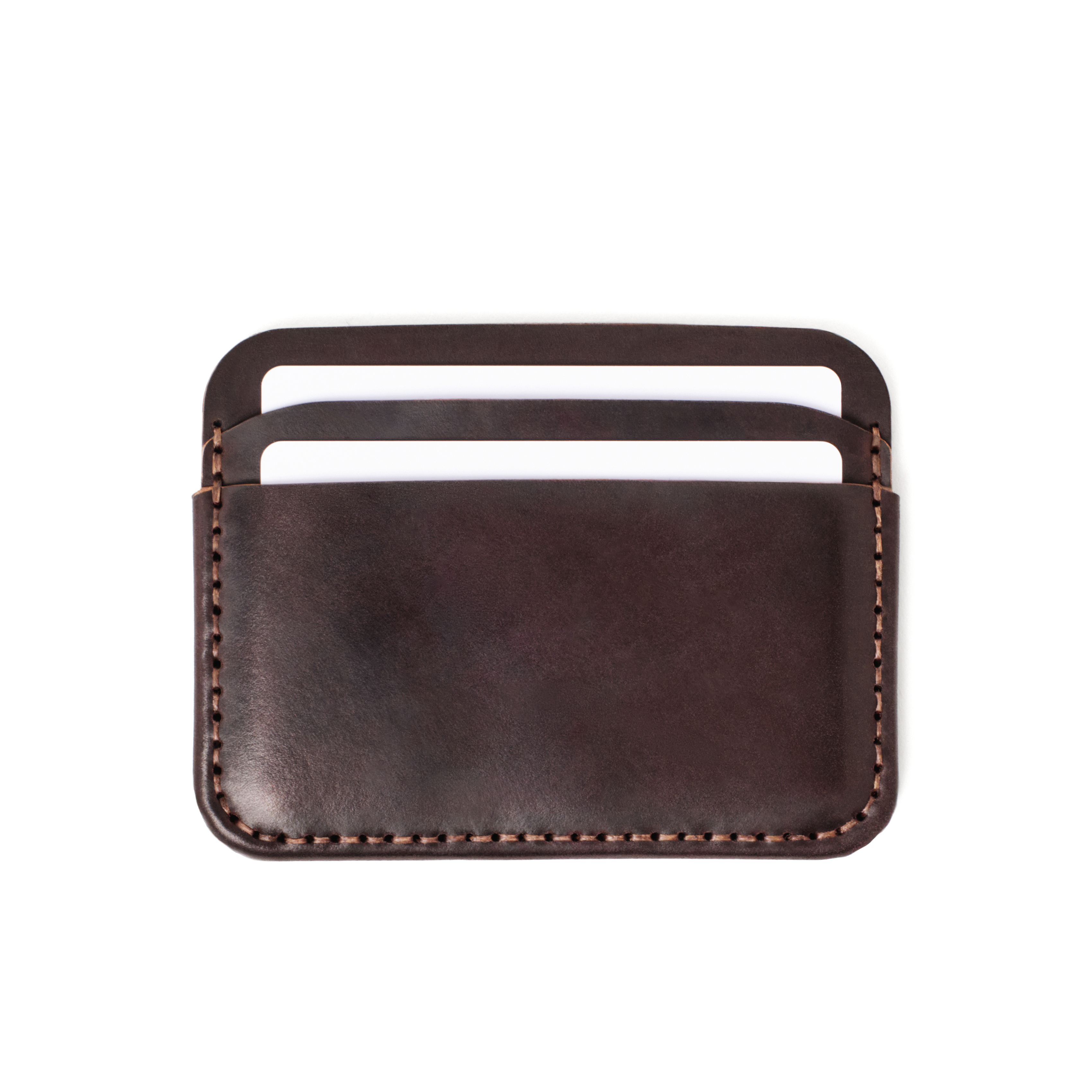 Front of the MAKR Round Luxe PLUS Wallet in Ox Blood Horween Shell Cordovan with cards loaded.