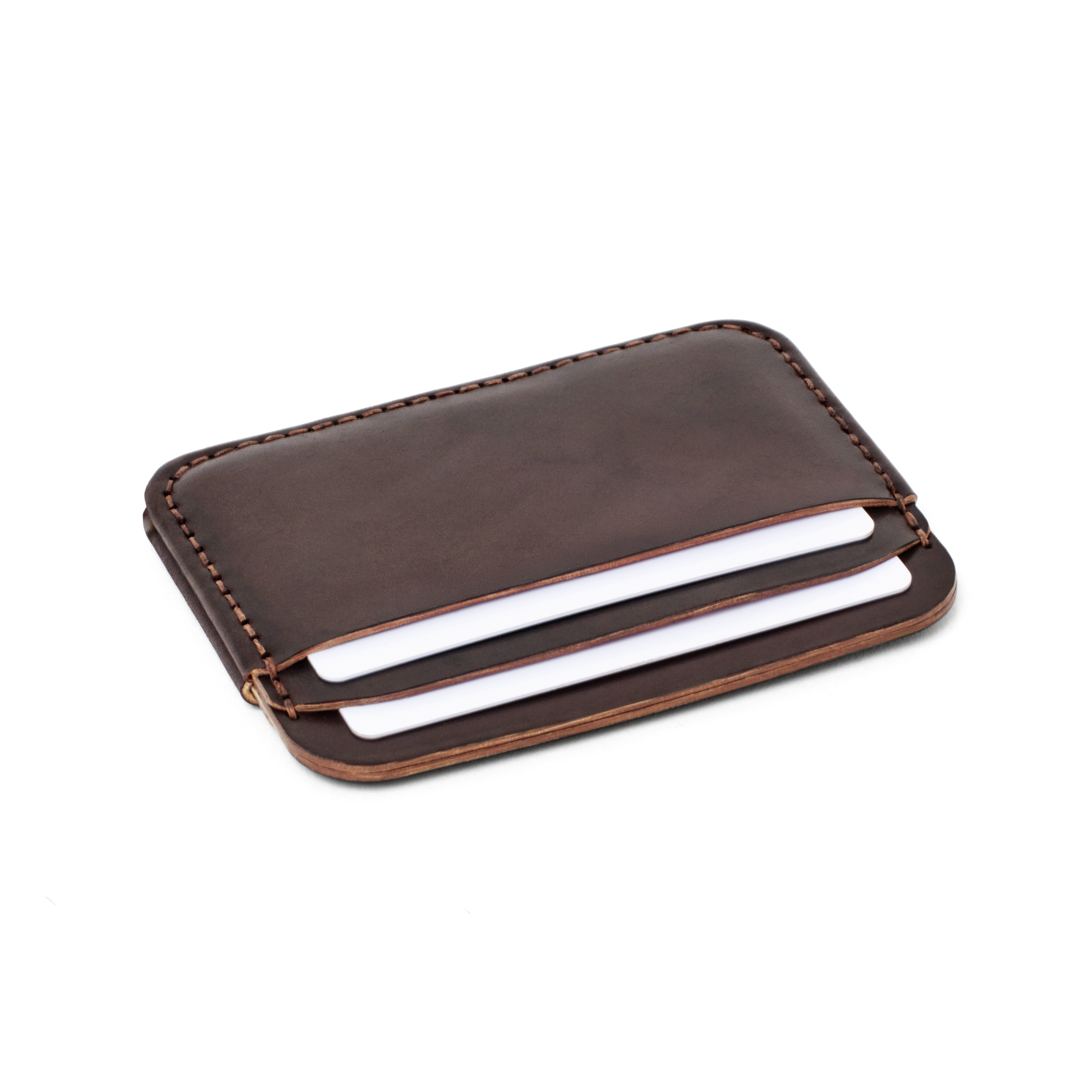 Angled view of the MAKR Round Luxe PLUS Wallet in Ox Blood Horween Shell Cordovan holding cards.