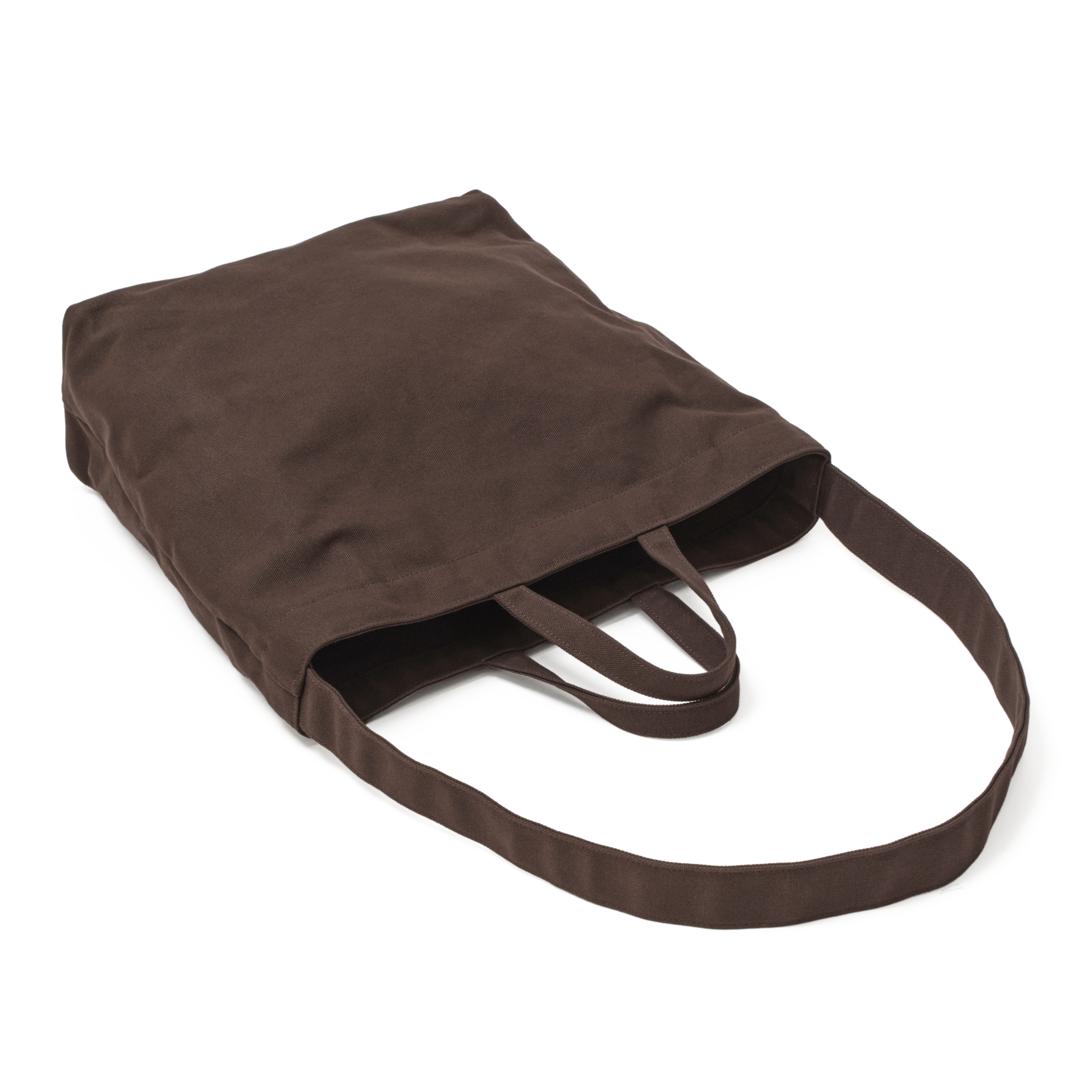 The MAKR Vert Sling Tote in Brown heavy cotton duck canvas, shown at an angle.