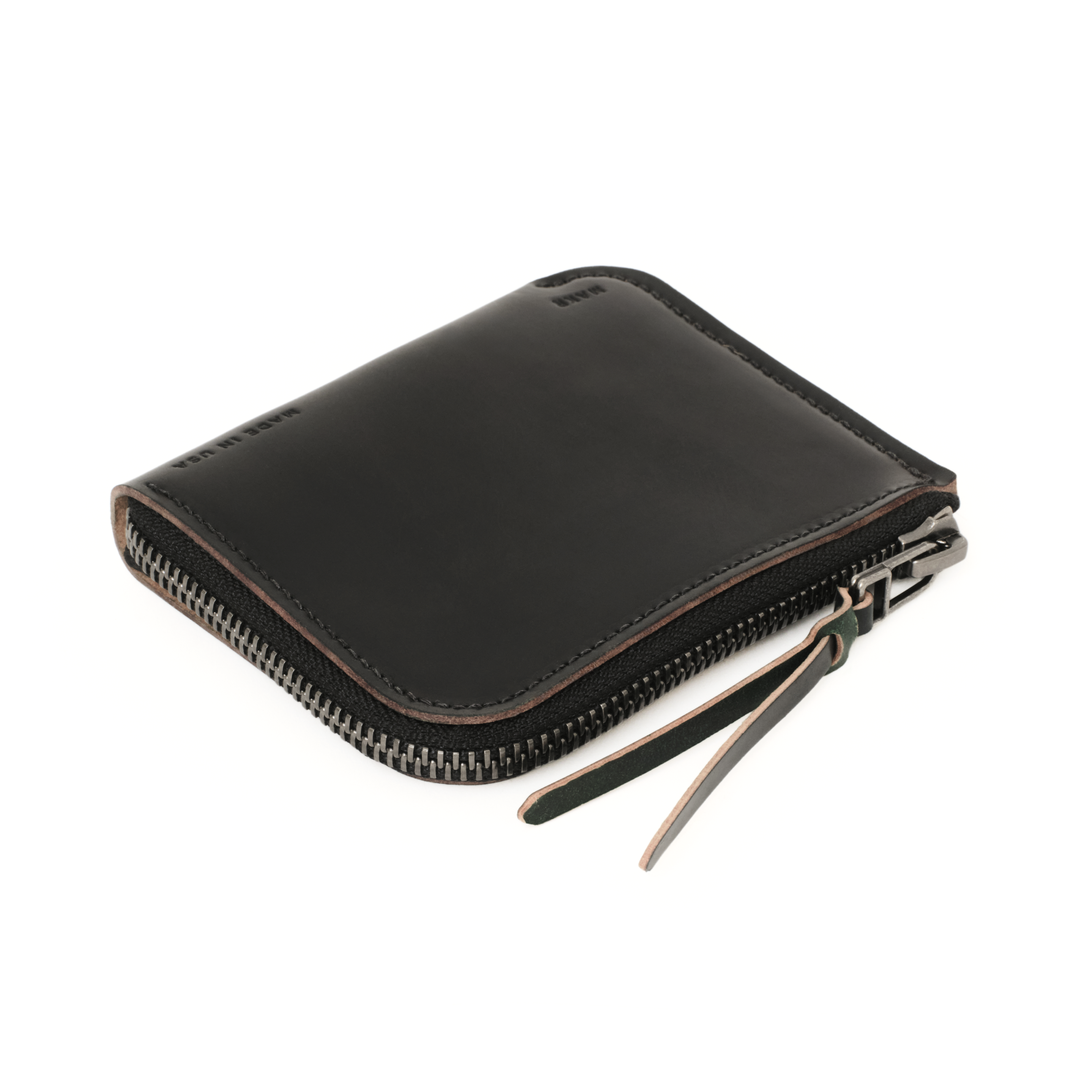 The MAKR Cordovan Zip Luxe V2 Wallet in Black Horween Shell Cordovan, shown at an angle.