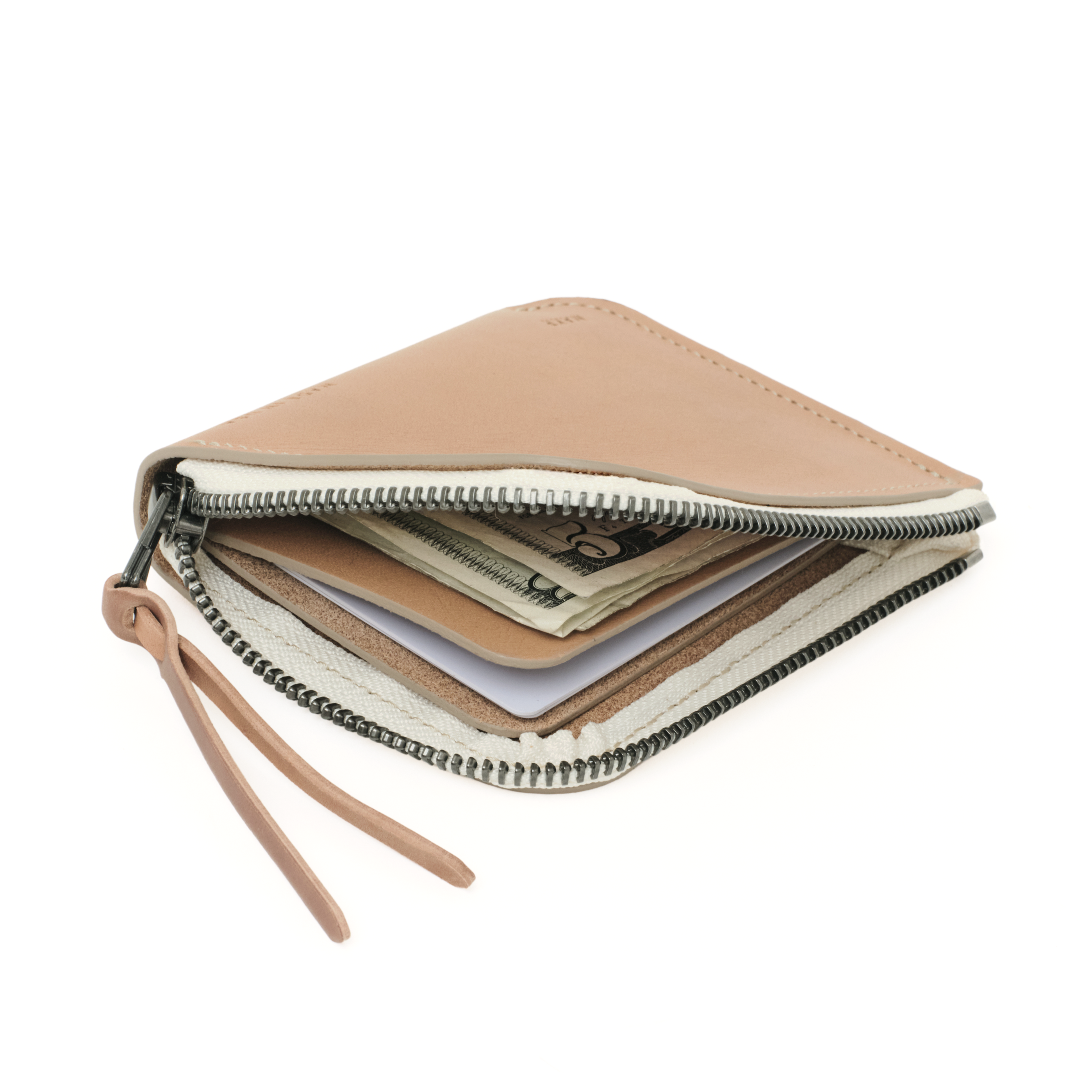 Angled view of the MAKR Zip Luxe V2 Wallet in Natural Horween Latigo leather, unzipped.
