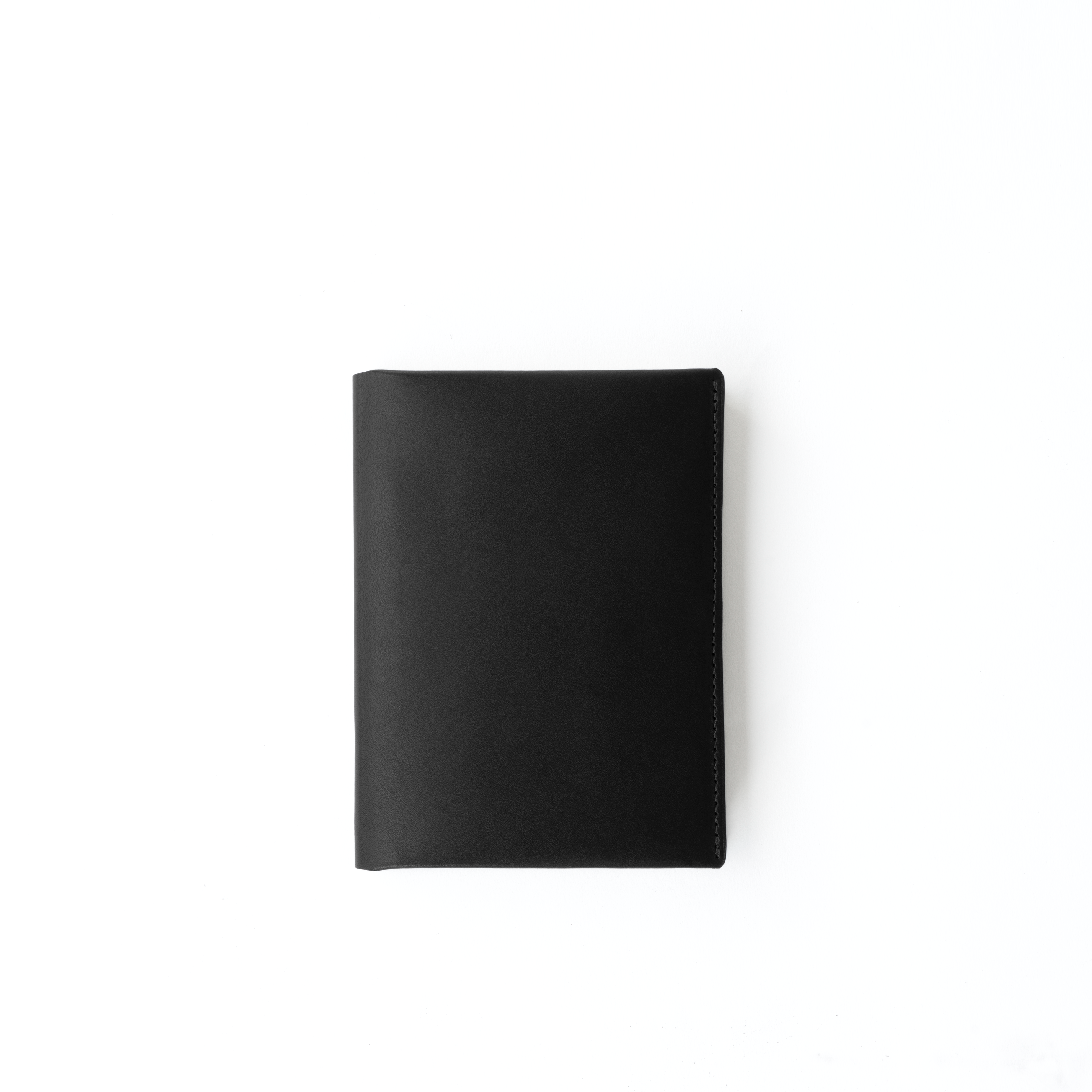 Front view of the MAKR Midori Cover SM (A6) in Black Horween Latigo leather.